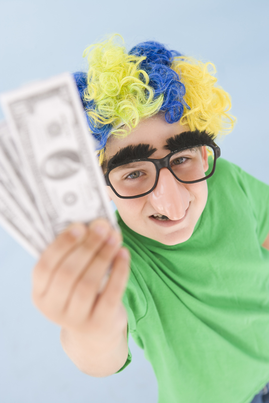 boy wearing clown wig and glasses with money