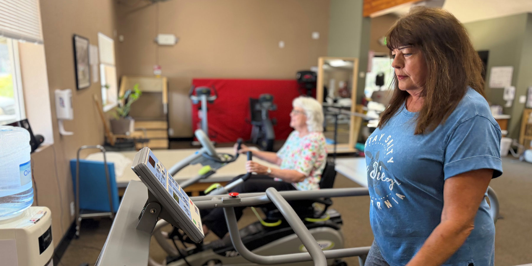 Photo of PDH Skiled Nursing Facility Staff Checking on a Patient