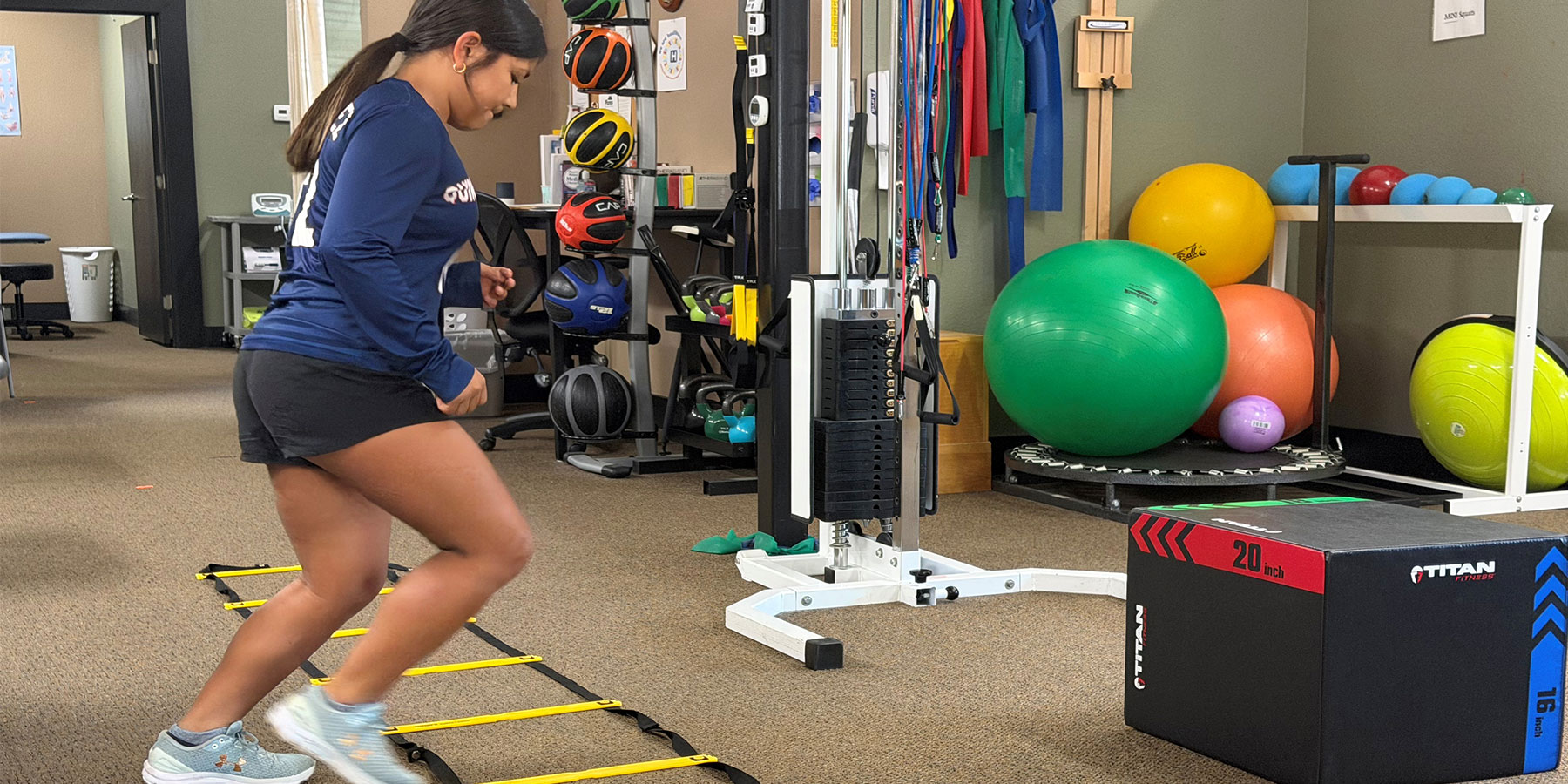Photo of girl exercising in PDH Rehab and Wellness facility.